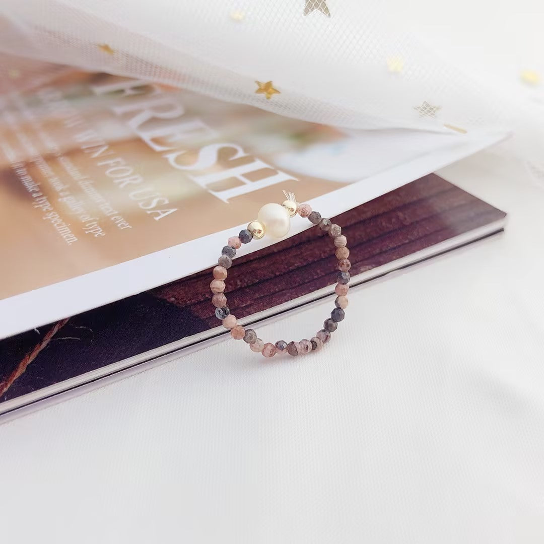 Simple rhodochrosite bungee string pearl ring