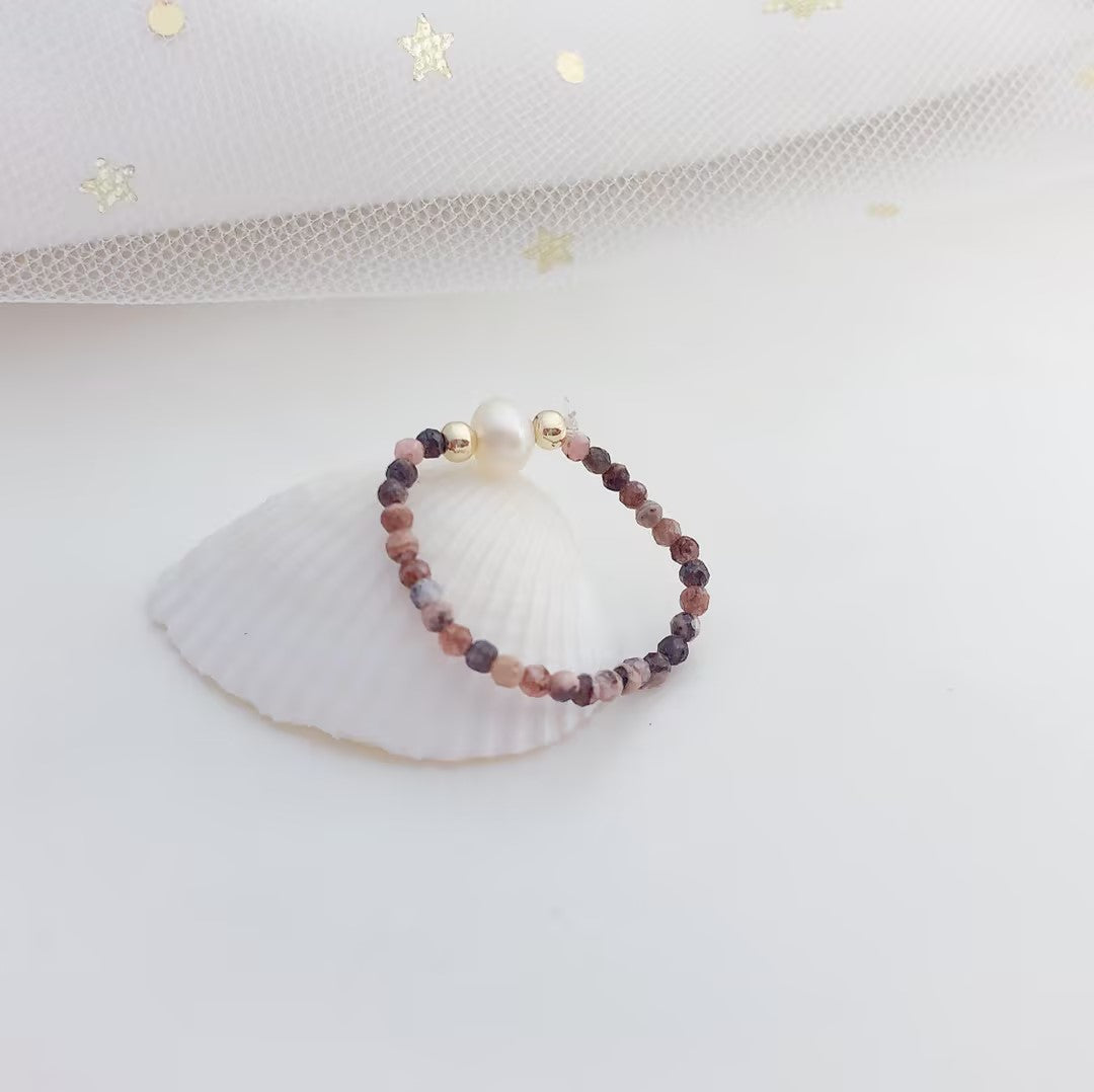 Simple rhodochrosite bungee string pearl ring