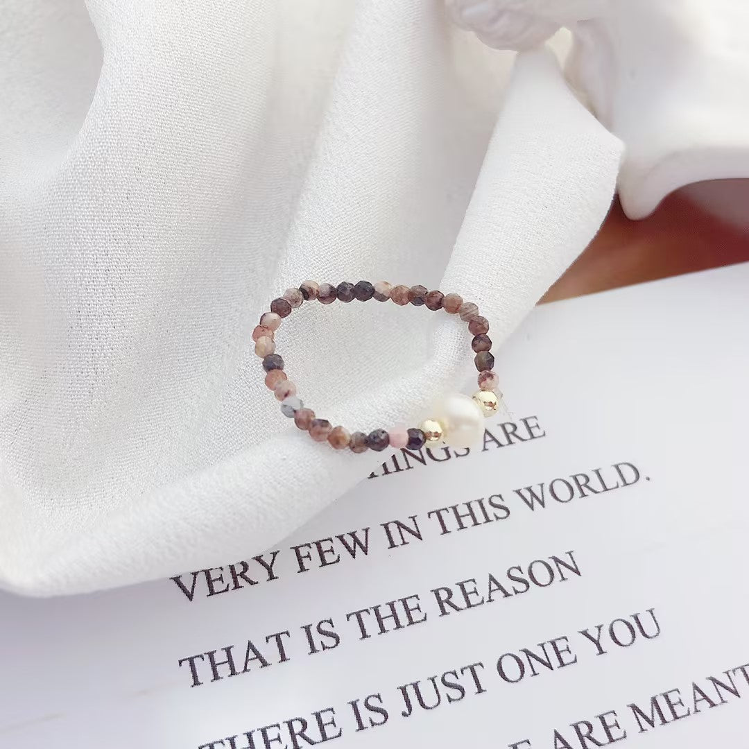 Simple rhodochrosite bungee string pearl ring